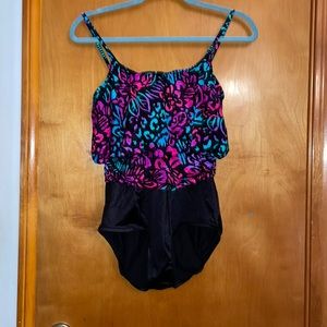 One piece bathing suit. Top multicolored print with waist for a blousey look